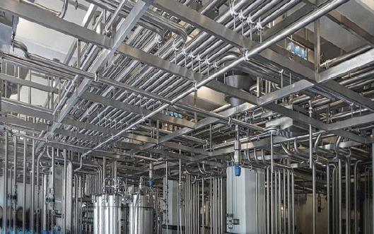 Stainless steel process piping system installation across multiple plant types
