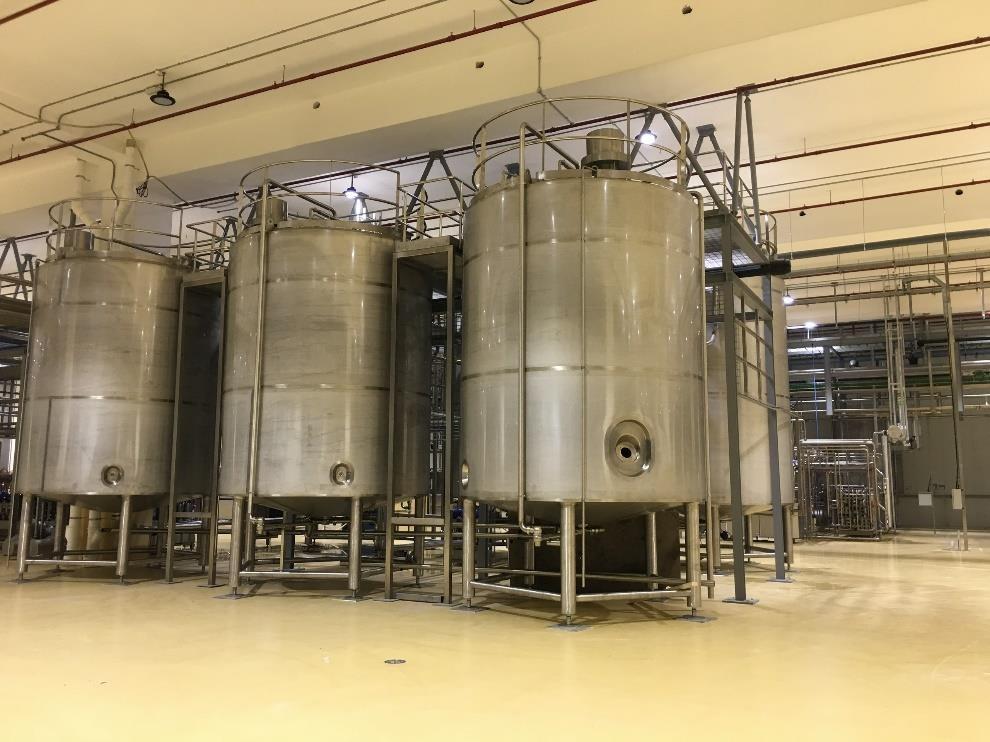 Milk process line tanks and piping installation at dairy plant